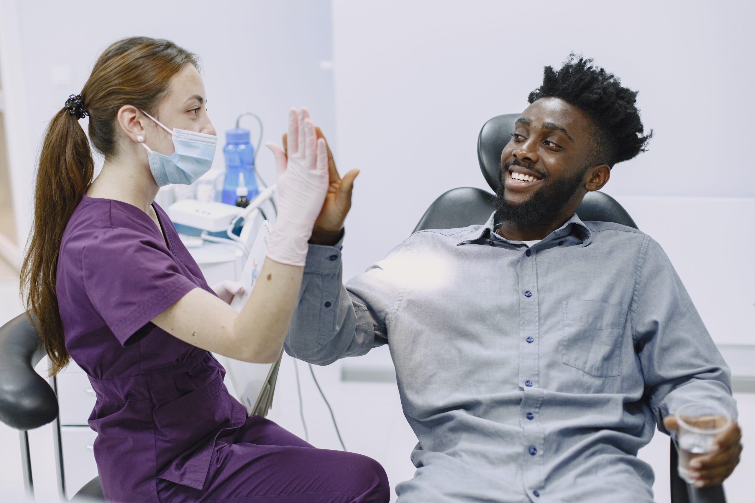 A patient and a nurse high-fiving